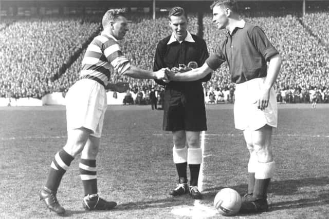 Hearts' Freddie Glidden (right) shakes hands with Celtic's Bobby Evans ahead of kick-off. Picture: TSPL