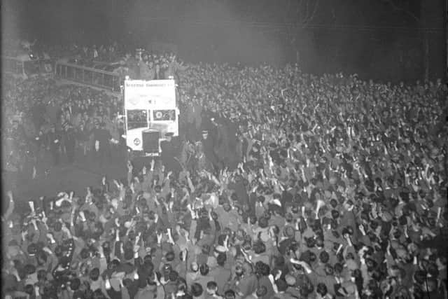 Hearts parade the 1956 Scottish Cup on an open-top bus in Edinburgh. Picture: TSPL
