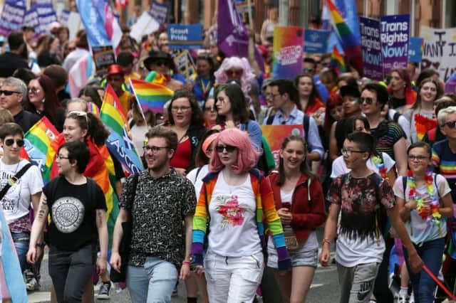 People take part in Pride Glasgow, Scotland's lesbian, gay, bisexual, transgender and intersex (LGBTI) pride event in Glasgow