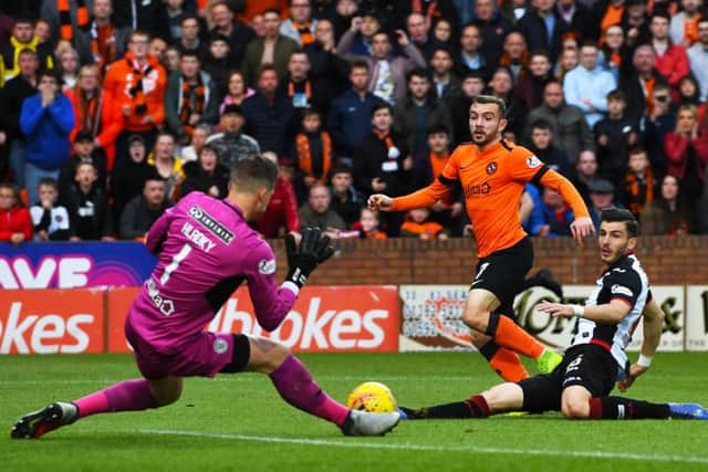 Dundee United's Paul McMullan watches his first-half shot saved by Vaclav Hladky in last night's Premiership play-off final first leg. Picture: SNS