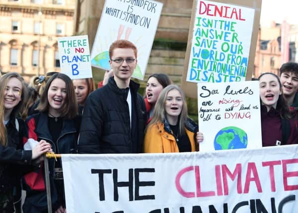 Green MSP Ross Greer in Glasgows George Square with hundreds of mostly young people who took time off school to take part in a country-wide protest against climate change. Picture: John Devlin