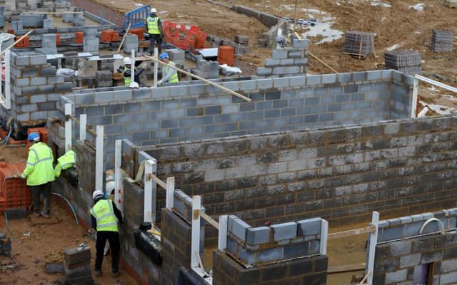 The work of Scots builders continues amid the political chaos. Picture: Andrew Matthews/PA