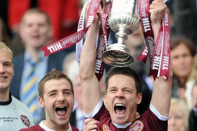 Ian Black lifts the Scottish Cup with Scott Robinson to his right after Hearts defeated Hibs 5-1 in 2012. Picture: Ian Rutherford