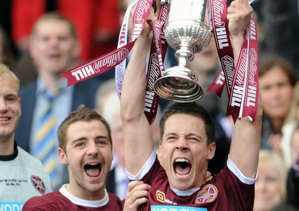 Ian Black lifts the Scottish Cup with Scott Robinson to his right after Hearts defeated Hibs 5-1 in 2012. Picture: Ian Rutherford