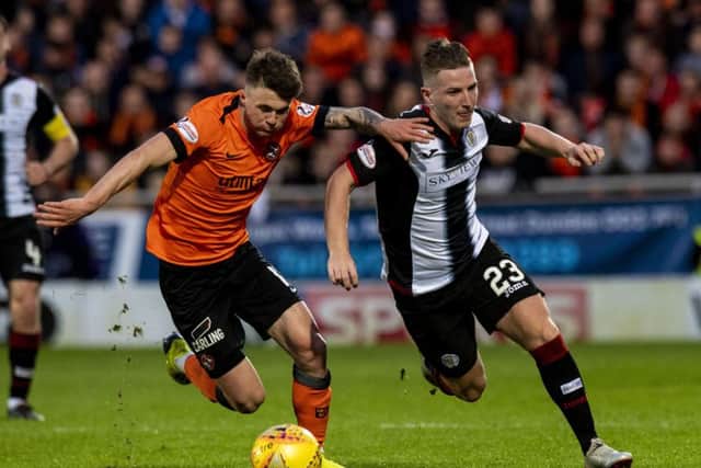 Jamie Robson tussles with St Mirrens Kyle McAllister during Thursdays 0-0 draw in the first leg of their Play-Off final at Tannadice. Picture: SNS