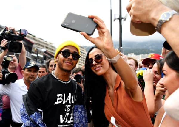 Lewis Hamilton poses for a selfie with a fan in Monte Carlo. Picture: Michael Regan/Getty