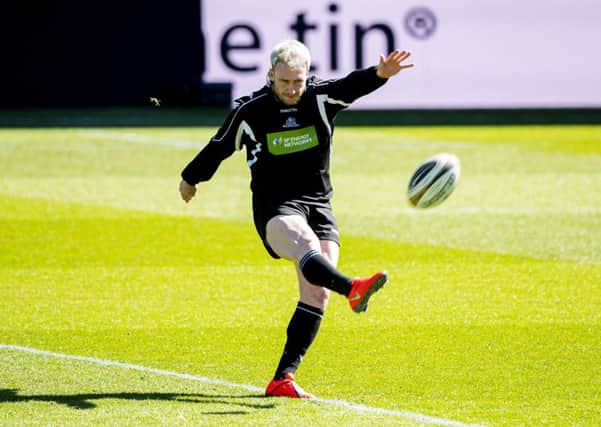 Glasgow full-back Stuart Hogg practises his kicking as he familiarises himself with the Celtic Park pitch. Picture: SNS