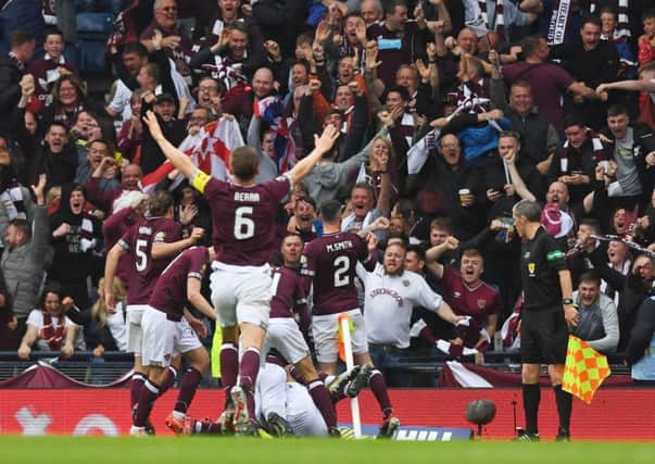 Hearts' players celebrate Ryan Edwards' opener with the fans. Pic: SNS/Craig Williamson