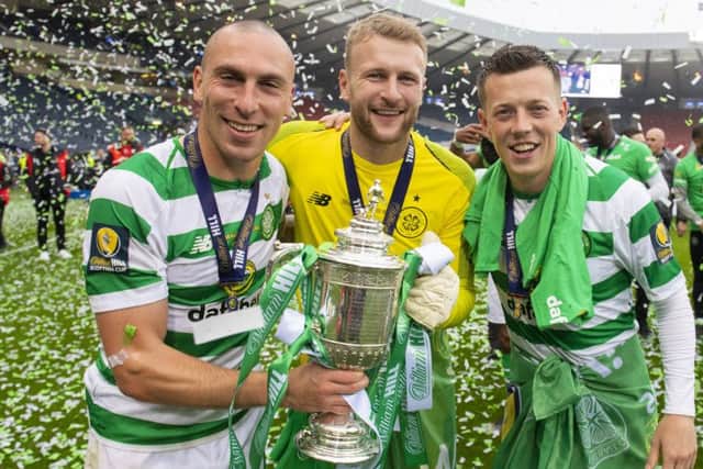 Celtic's Scott Brown, Scott Bain and Callum McGregor (L-R) celebrate winning the William Hill Scottish Cup. Pic: SNS/Alan Harvey