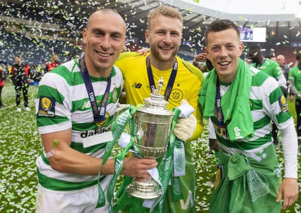 Celtic's Scott Brown, Scott Bain and Callum McGregor (L-R) celebrate winning the William Hill Scottish Cup. Pic: SNS/Alan Harvey