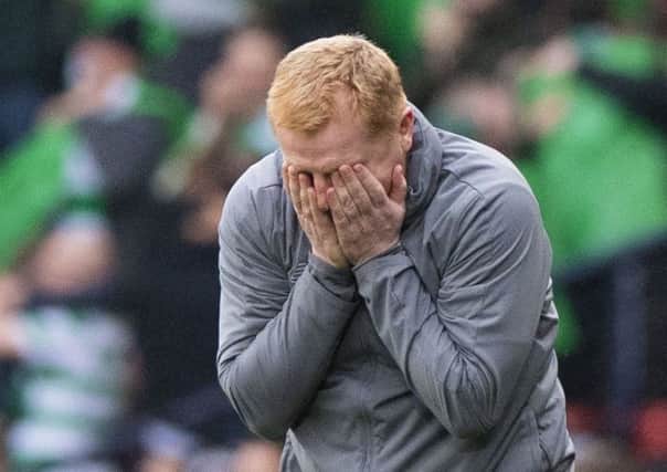Celtic manager Neil Lennon is overcome with emotion on the full time whistle. Pic: SNS/Alan Harvey