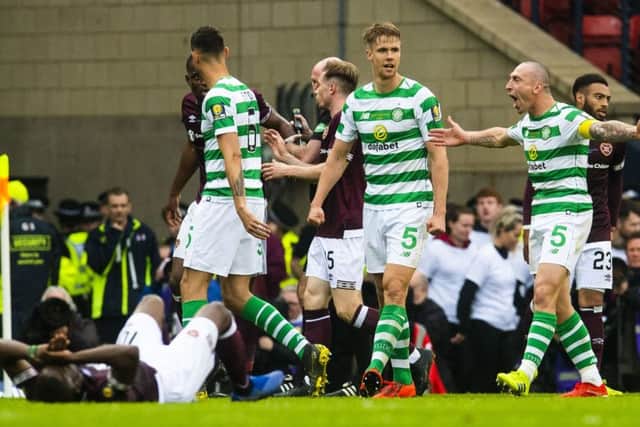 Celtic captain Scott Brown and Uche Ikpeazu collide in the second half. Pic: SNS/Craig Foy