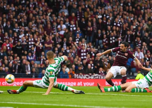 Ryan Edwards fires Hearts ahead in the second half but the goal wasn't enough to stop Celtic's treble-treble. Picture: SNS