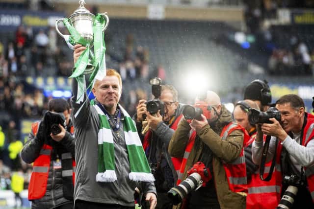 Neil Lennon lifts the Scottish Cup aloft after guiding Celtic to the treble-treble. Picture: Craig Foy/SNS