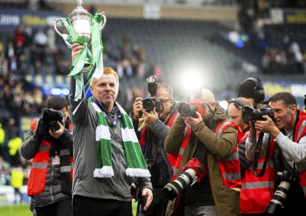 Neil Lennon lifts the Scottish Cup aloft after guiding Celtic to the treble-treble. Picture: Craig Foy/SNS