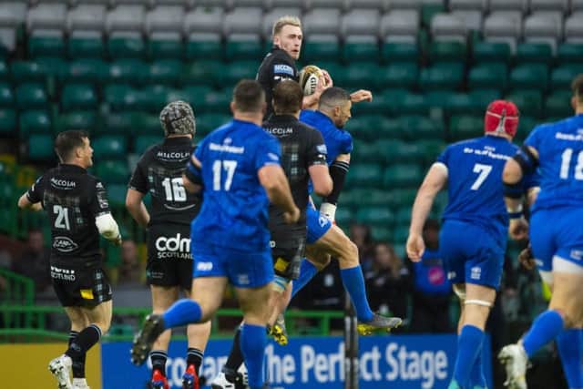 Rob Kearney's tackle of Stuart Hogg in the air, left, proved to be a controversial moment. Picture: Bill Murray/SNS