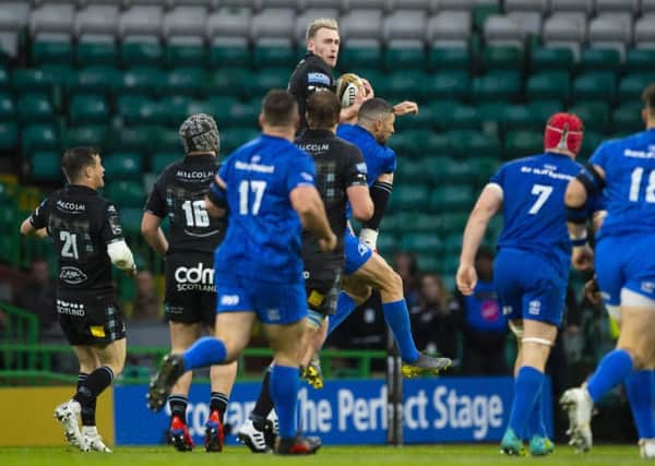Rob Kearney's tackle of Stuart Hogg in the air, left, proved to be a controversial moment. Picture: Bill Murray/SNS