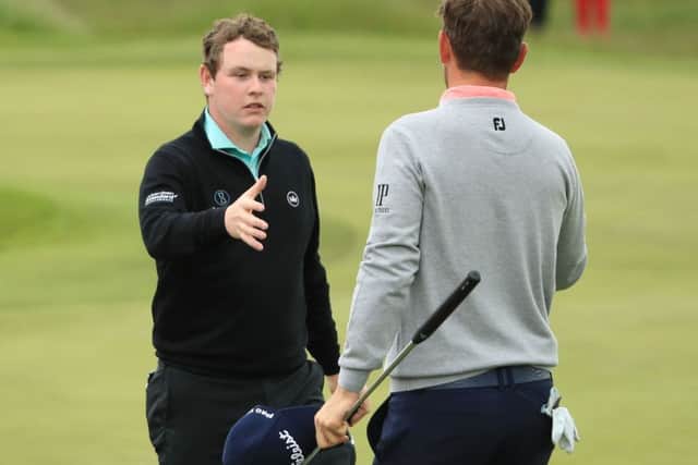 Bob Macintyre, left, shakes hands with winner Bernd Wiesberger. Picture: Getty.