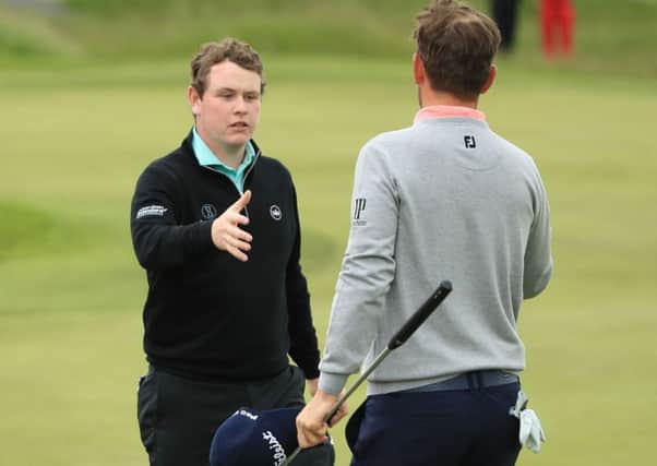 Bob Macintyre, left, shakes hands with winner Bernd Wiesberger. Picture: Getty.