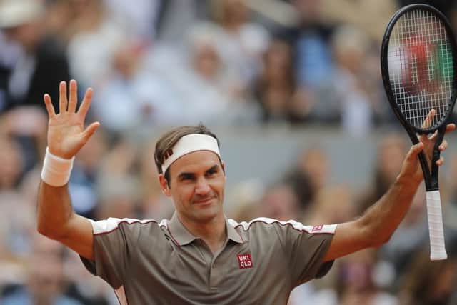 Roger Federer acknowledges the crowd at the French Open as they welcome him back to Roland Garros. Picture: AP.