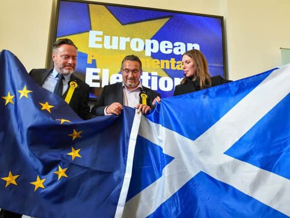 Alyn Smith, Christian Allard and Aileen McLeod, Scotland's three new SNP MEPs, show their colours (Picture: Jeff J Mitchell/Getty Images)