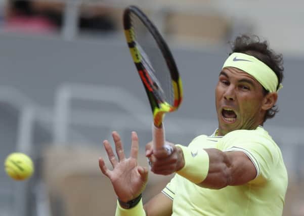 Rafael Nadal thumps a forehand return on his way to a straight-sets win over Yannick Hanfmann at Roland Garros. Picture: Pavel Golovkin/AP