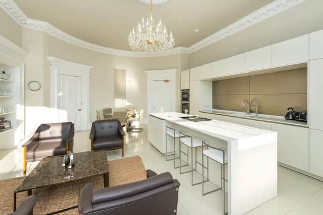 The kitchen also has a bar area ideal for informal dining.