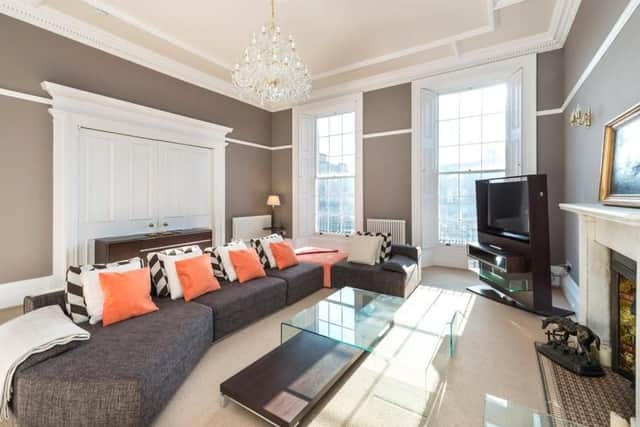 The property has many original features such as cornicing - seen here in the sitting room.