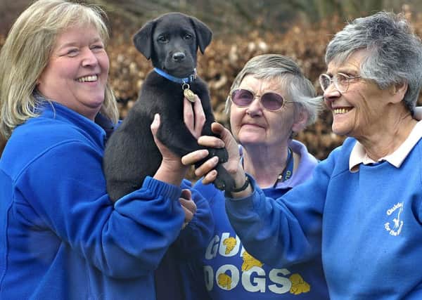 Betty Brown, right, with, from left, Rosheen Milner, puppy Uri and sister Alison Brown