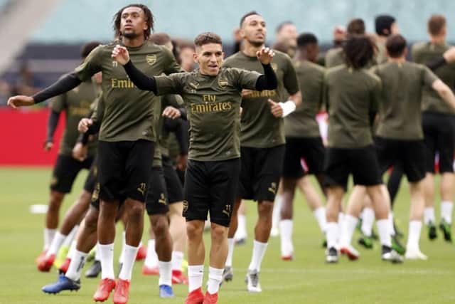 In the foreground, Arsenal's Lucas Torreira leads a training session at the Olympic Stadium in Baku, the venue for tonight's Europa League final. Picture: Darko Bandic/AP