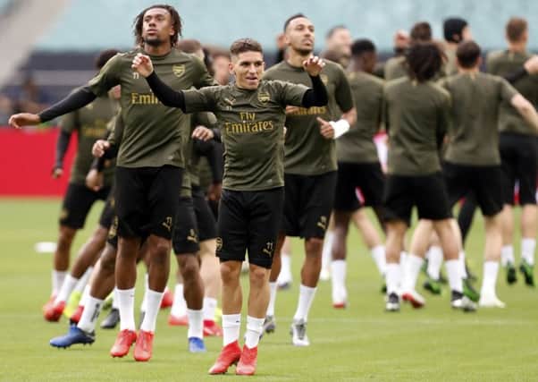In the foreground, Arsenal's Lucas Torreira leads a training session at the Olympic Stadium in Baku, the venue for tonight's Europa League final. Picture: Darko Bandic/AP