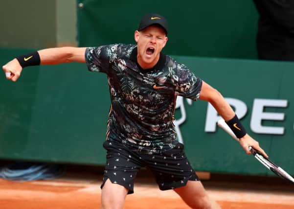 Kyle Edmund celebrates after completing  his 7-6, 5-7, 6-4, 4-6, 7-5 first-round victory over Fenchman Jeremy Chardy yesterday. Picture: Getty