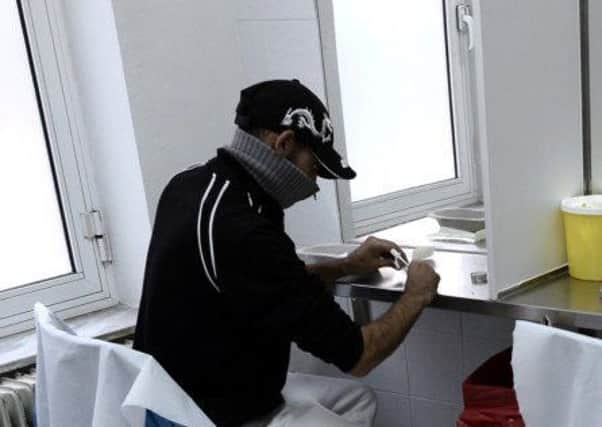 Someone taking drugs in a 'consumption room'. Picture: AFP/Getty Images)