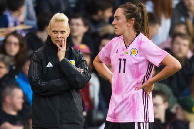 Head coach Shelly Kerr and Lisa Evans watch as Scotland win their wearm-up match against Jamaica. Picture: SNS.