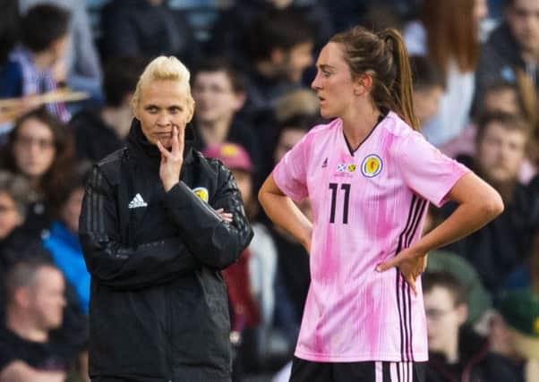 Head coach Shelly Kerr and Lisa Evans watch as Scotland win their wearm-up match against Jamaica. Picture: SNS.