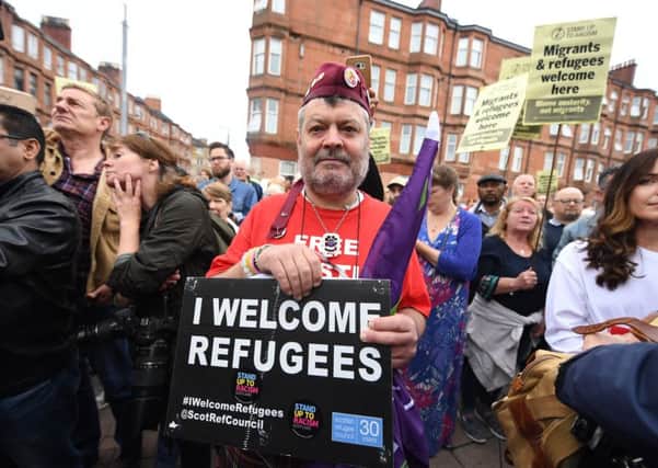 Around 25 per cent said Scotland should welcome more refugees. Picture: John Devlin