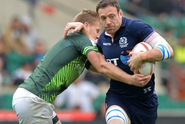 Scotland's Scott Riddell is tackled by South Africa's Philip Snyman during the final of the World Rugby Sevens Series. Picture: Olly Greenwood/Getty