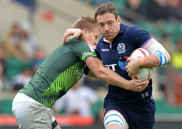 Scotland's Scott Riddell is tackled by South Africa's Philip Snyman during the final of the World Rugby Sevens Series. Picture: Olly Greenwood/Getty