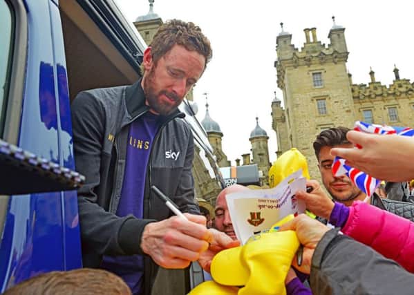 Sir Bradley Wiggins signs autographs at the finish of a stage in the 2015 Tour of Britain at Floors Castle in Kelso (Picture: Ian Georgeson)