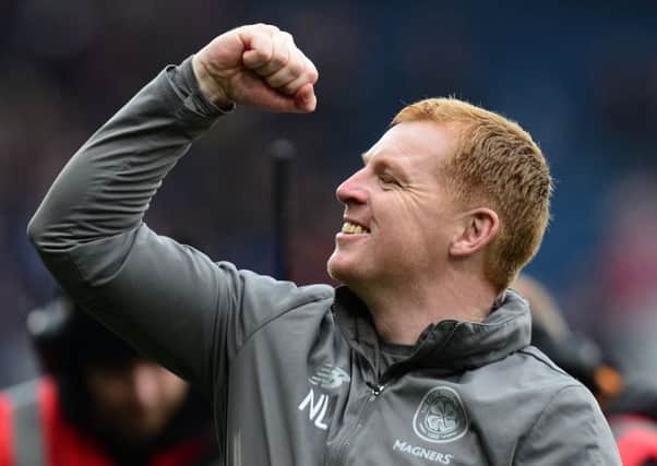 Neil Lennon celebrates clinching the treble treble, but next season he is likely to alter the focus of Celtics play. Picture: Getty.