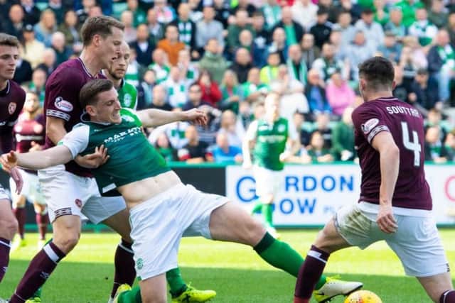 Hearts academy graduate Christophe Berra battles with Hibs academy graduate Paul Hanlon in the final Edinburgh derby of the season