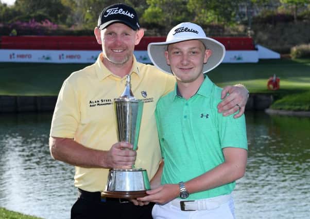 Stephen Gallacher, pictured with his son Jack after winning the Hero Indian Open, is playing in next week's GolfSixes. Picture: Getty Images