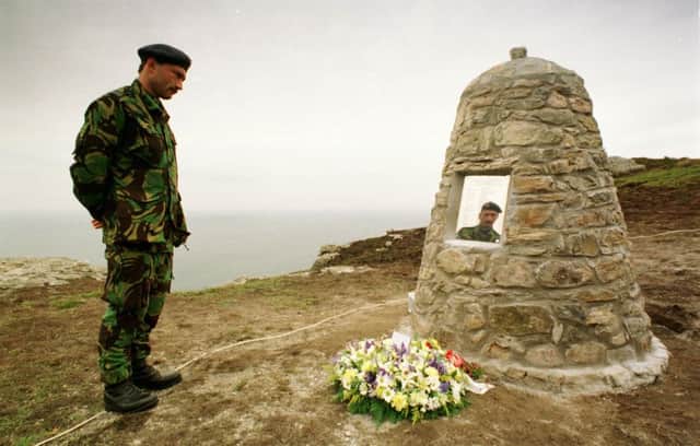 A cairn stands at the crash site, marked with the names of the passengers and crew who died