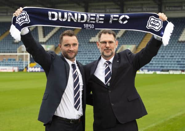 James McPake, left, is unveiled as Dundees new manager by managing director John Nelms at Dens Park yesterday. Picture: SNS.