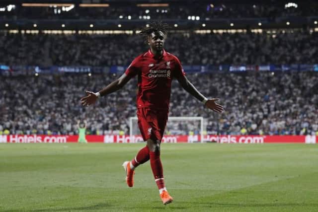 Divock Origi wheels away after scoring the second goal