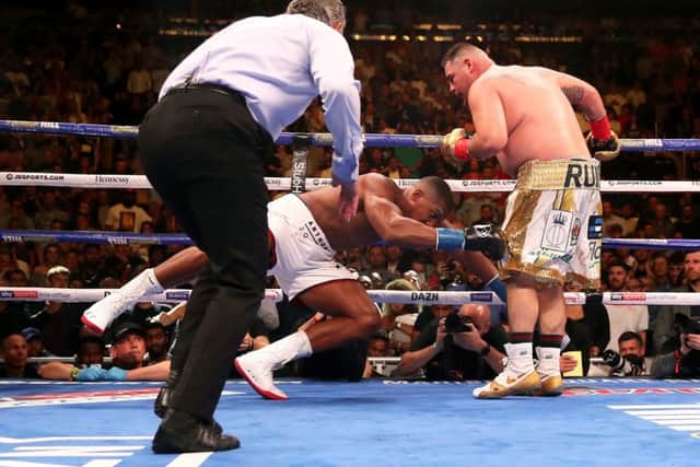 Anthony Joshua is dropped to the canvas for the fourth time by Andy Ruiz. Picture: PA.