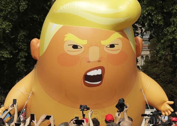 A six-meter high cartoon baby blimp of U.S. President Donald Trump. Picture: AP Photo/Matt Dunham