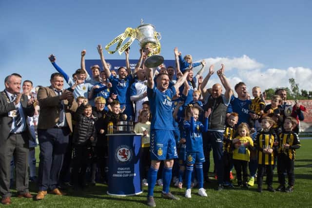 Captain Willie Lyle hoists the Scottish Junior Cup following Auchinleck Talbots 2-0 victory over Largs Thistle. Picture: SNS.