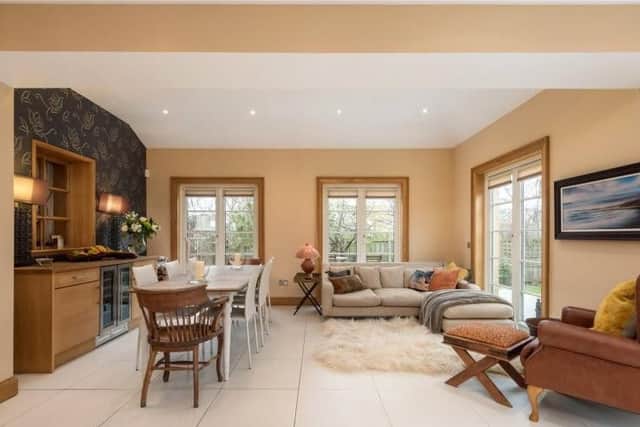 This comfortable family room is ideal for informal dining and relaxing.