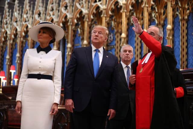 US President Donald Trump, accompanied by his wife Melania and the Duke of York, places a wreath on the Grave of the Unknown Warrior during a tour of Westminster Abbey in central London, on day one of his state visit to the UK. PRESS ASSOCIATION Photo. Picture date: Monday June 3, 2019. See PA story ROYAL Trump. Photo credit should read: Stefan Rousseau/PA Wire